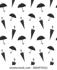 Vector seamless pattern of black different hand drawn doodle sketch umbrella isolated on white background