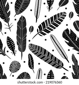 Vector seamless pattern with black feathers.