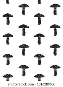 Vector seamless pattern of black hand drawn doodle sketch fly agaric mushroom isolated on white background
