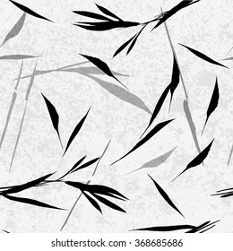 Vector seamless pattern. Black hand drawn bamboo leaves on a light grey background. Asian sumi-e style.