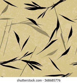 Vector seamless pattern. Black hand drawn bamboo leaves on a beige background. Asian sumi-e style.