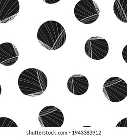 A Vector seamless pattern of black hand-drawn circles polka dot isolated on a white background