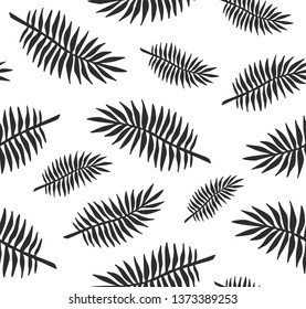 Vector seamless pattern of black ink hand drawn palm tree leaves silhouette isolated on white background 