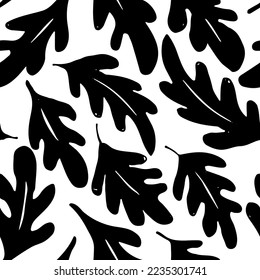 Vector seamless pattern with black  leaves oak and acorns . Hand drawn ink texture with abstract silhouette leaves and acorns. Monochrome nature ornament for fabric, wrapping and textile.  
