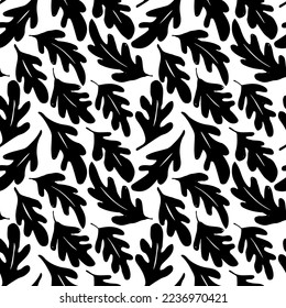 Vector seamless pattern with black  leaves oak and acorns . Hand drawn ink texture with abstract silhouette leaves and acorns. Monochrome nature ornament for fabric, wrapping and textile.  
