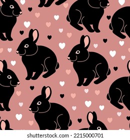 Vector seamless pattern with black rabbits on a pink background