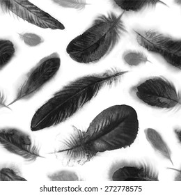 Vector seamless pattern with black watercolor feathers on white background