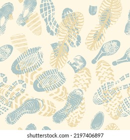 Vector seamless pattern blue and yellow double footprints on pale yellow background
