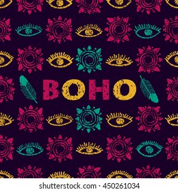 Vector seamless pattern in the bohemian style. Repeating tribal print of eyes, tribal sun, feather. Ethnic grunge pattern and elements