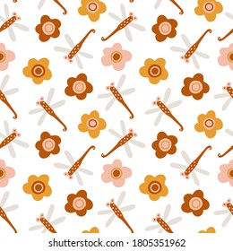 Vector seamless pattern with boho colors dragonflies and flowers on white. Perfect decoration for kids playroom and bedroom, wallpapers, fabrics. Muted trendy colors. Wrapping papers, covers, textile.