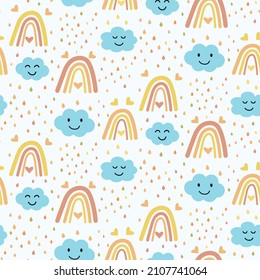 Vector seamless pattern with boho rainbow , smiling blue clouds and colorful raindrops. Great for nursery wall , kids cloths ,  fabric and baby shower 
