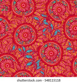 Vector seamless pattern in boho style. Red and blue colors, mandala flower. Boho background.