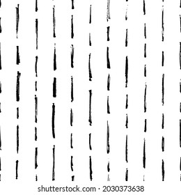 Vector seamless pattern with brush stripes and thin strokes. Black vertical dashes on white background. Hand painted grunge texture. Dry rough smears and short brushstrokes. Modern art background