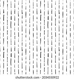 Vector seamless pattern with brush stripes and thin strokes. Black vertical dashes on white background. Hand painted grunge texture. Dry rough smears and short brushstrokes. Modern art background