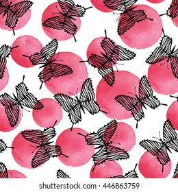 Vector seamless pattern with butterflies on a polka dot background