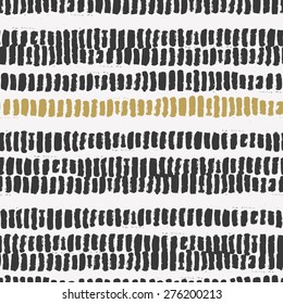 Vector seamless pattern with calligraphic brush stroke stripes. Scandinavian style concept. Black and gold colors. Good for web page backgrounds, wedding cards, birthday invitations, fabric prints. 