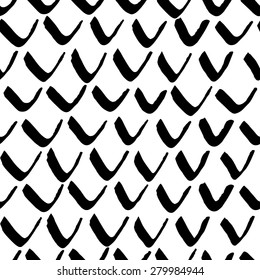 Vector seamless pattern with calligraphic brush stroke boomerangs. Scandinavian hand drawn pattern. Good for wedding card, birthday invitation, pattern fill, web page background, wallpaper, poster