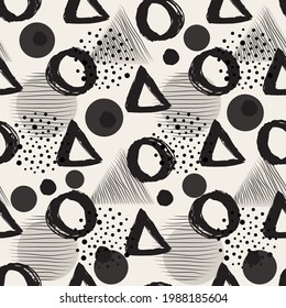 Vector seamless pattern with careless strokes in the form of a circle and triangles. Abstract background made using of brush smears. Black and white hand drawn texture.