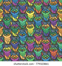 Vector seamless pattern of cartoon colored funny owls.