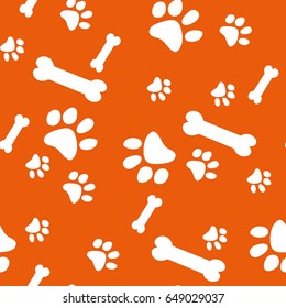 Vector seamless pattern with cat and bone footprints.Orange background. Can be used for wallpaper, web page background, surface textures.