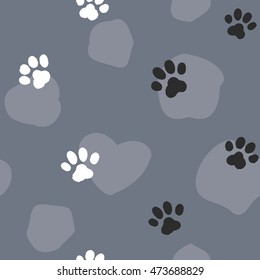 Vector seamless pattern of the cat tracks with spots on the cat's grey skin. Illustration with animal black and white footprints on the grey pelage with spots.