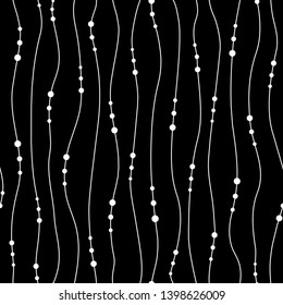 Vector seamless pattern. Chains of pearls forming an ornament. Decorative element for cards, wedding invitations. Jewelry black white background, texture. Garlands with balls. Repeating Pearl necklace