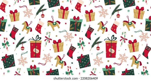 Vector seamless pattern with Christmas decoration in flat style. New Year stylish background of Christmas gift boxes, presents, socks, toys, candy cane, snowflake, fur tree branch, stars and confetti.
