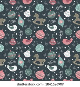 vector seamless pattern for christmas and new year theme with hand drawn christmas tree decorations, fir branches and snowflakes on dark blue background