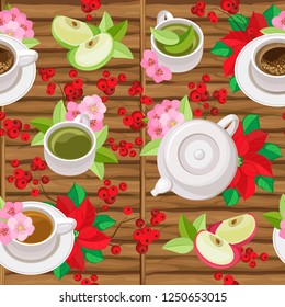 Vector seamless pattern. Christmas tea at the wooden table. Cups of tea, cups of coffee, poinsettia, holly berries and apple slices surrounded by apple flowers