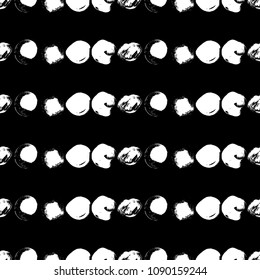 Vector seamless pattern with circles. White brush strokes on black background. Abstract hand drawn illustration.