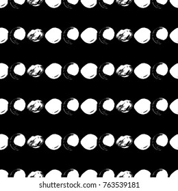 Vector seamless pattern with circles. White brush strokes on black background. Abstract hand drawn illustration.
