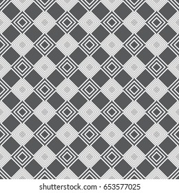 Vector seamless pattern. Classical stylish texture with rhombuses and diamonds which form regularly repeating tiled checkered surface. Plaid geometric background.