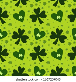 Vector seamless pattern with clover leaves on a green background. Suitable for St. Patrick's Day or spring design. For the design of fabric, wrapping paper, wallpaper.