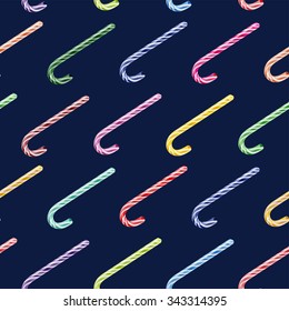 Vector seamless pattern with colored Christmas candy cane isolated on dark blue background