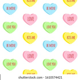 Vector seamless pattern of colored hand drawn doodle sketch valentine candy hearts with love text isolated on white background