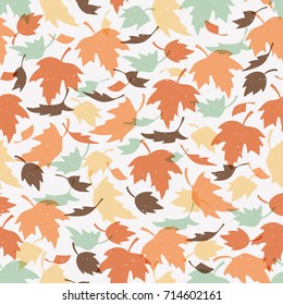 Vector seamless pattern with colorful autumn leaves. Various red, orange and yellow leaves on light grey background. Modern leaf texture