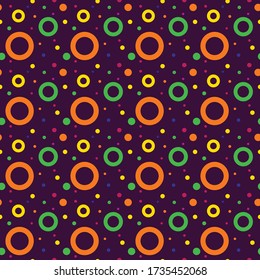 Vector seamless pattern of colorful circles isolated on violet background. Can be used for unisex t-shirt print, fashion print design, kids wear, baby shower celebration greeting and invitation card.