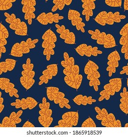 Vector seamless pattern colorful design of autumn orange oak leaves on dark blue. The design is perfect for backgrounds, textiles, wrapping paper, wallpaper, decorations and surfaces