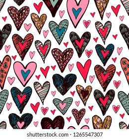 Vector seamless pattern with colorful different hearts. Hand drawn ink elements in cute doodle style. Perfectly for wrapping paper, kids clothing, bedding, valentine's day design, wallpaper, interior.