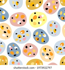 Vector seamless pattern with colorful eggs, ovals and dots. Creative Scandinavian Easter kids background for fabric, packaging, textile, wallpaper, clothing.