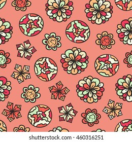 Vector seamless pattern with colorful floral doodle ornament on pink background