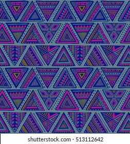 Vector seamless pattern with colorful hand drawn ethnic elements in blue, pink colors. Geometric design with triangle forms. Folk motif for fabric, textile, paper, postcards.