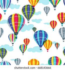 Vector seamless pattern with colorful hot air balloons in the sky. Hand drawn doodle illustration. Summer design for fabric and fashion textile print.