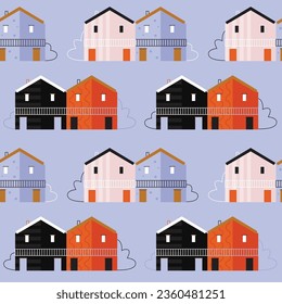 Vector seamless pattern with colorful houses on blue background. Modern design for fabric and paper, surface textures.