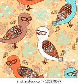 vector seamless pattern with colorful owls on a floral background