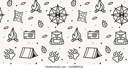Vector seamless pattern of compass, paws, backpack, tent, bonfire, camera, map for tourist symbol