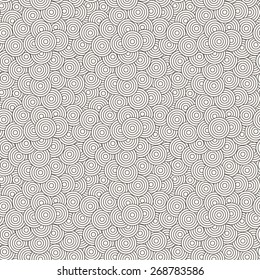 Vector seamless pattern of concentric circles superimposed randomly