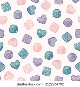 Vector seamless pattern. Coral, emerald, purple chocolate candies isolated on white background.
