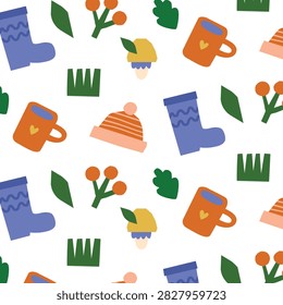Vector seamless pattern with cozy autumn objects, boots, mug, beanie and mushrooms