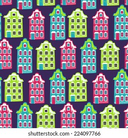 Vector seamless pattern with cozy houses. Cute hand drawing texture with bright buildings.
